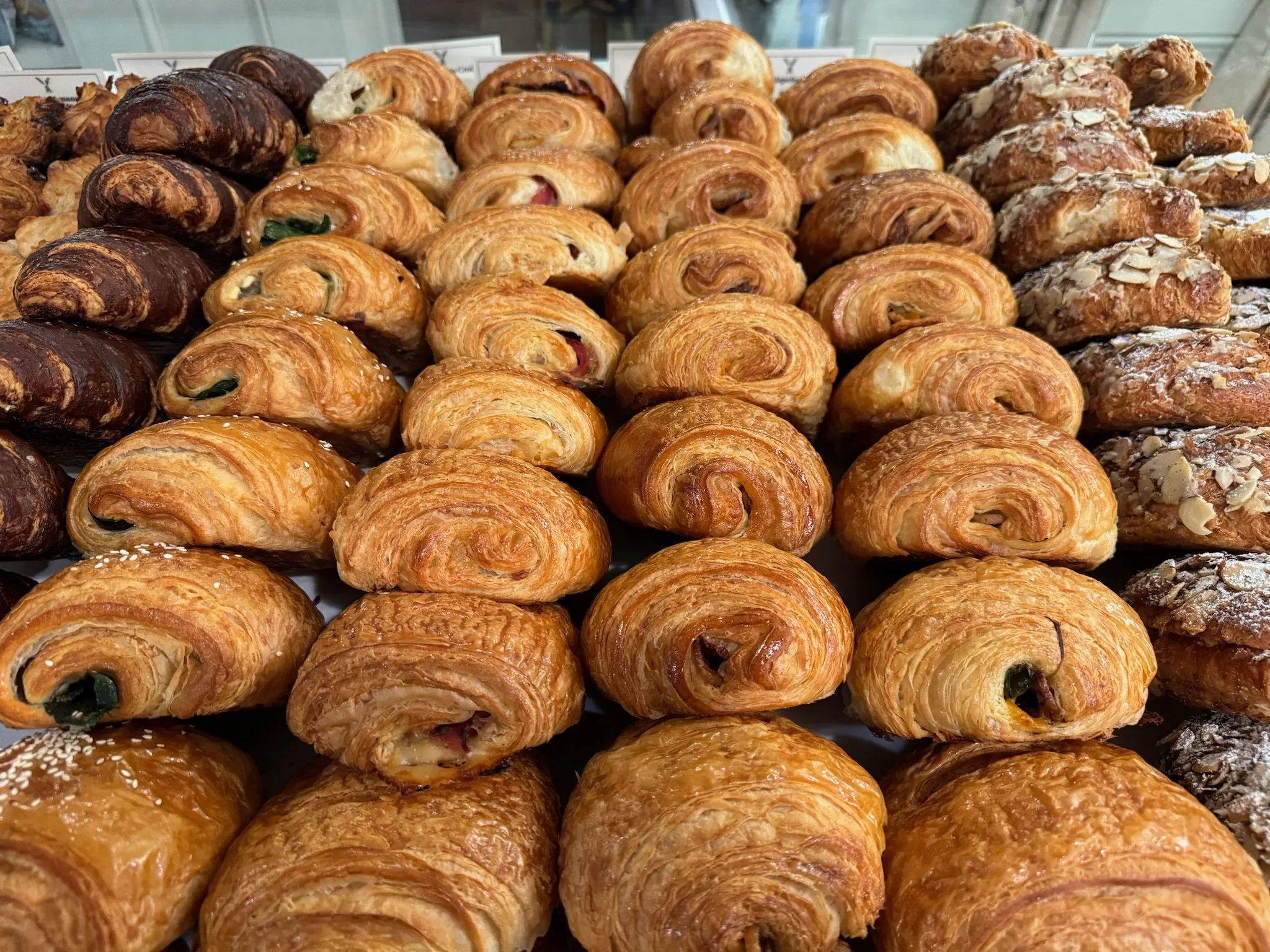 A tray of croissants and pastries