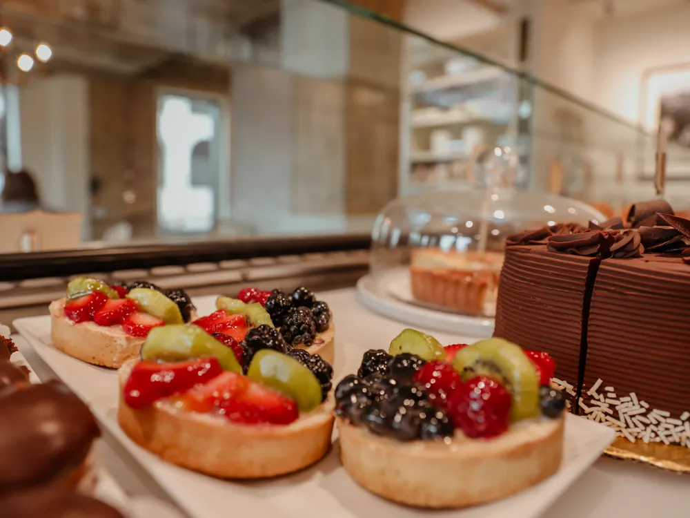 Tarts and cakes in the case